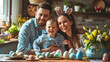 A happy family, father, mother and child are sitting at a festive table with colorful Easter eggs