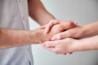 © anatoliy_gleb - Close up of two hands engaging in delicate touch. Man's and woman's hands on white neutral background. Husband holding hand of his lovely wife. Concept of affection, support, and mutual respect.