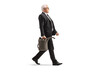 © Ljupco Smokovski - Full length profile shot of a mature businessman walking and carrying a gas canister