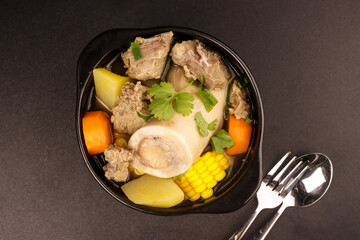 Wall Mural - Caldo De Res is a Mexican Beef Soup Made with Beef Bones, Potatoes, Corn and Vegetables.