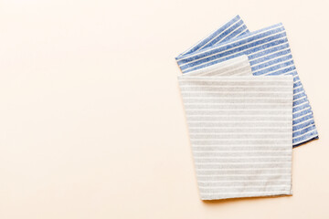 top view with gray kitchen napkin isolated on table background. Folded cloth for mockup with copy space, Flat lay. Minimal style