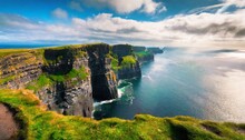 The Cliffs Of Moher Ireland Most Visited Natural Tourist Attraction Are Sea Cliffs Located At The Southwestern Edge Of The Burren Region In County Clare Ireland
