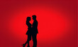 © 냥냥냥 난 - Couple silhouette. red background with copy space. Generative AI