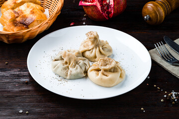 Canvas Print - Asian lunch manti with meat, pepper and bread.