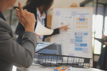 Close up ux developer and ui designer use augmented reality brainstorming about mobile app interface wireframe design on desk at modern office.Creative digital development agency