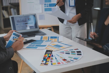 Close up ux developer and ui designer use augmented reality brainstorming about mobile app interface wireframe design on desk at modern office.Creative digital development agency