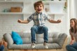 Happy little troublemaker misbehaves at a therapy session. Joyful naughty child boy jumping and having fun during a meeting with a children's therapist or psychologist. ADHD, hyperactivity concept