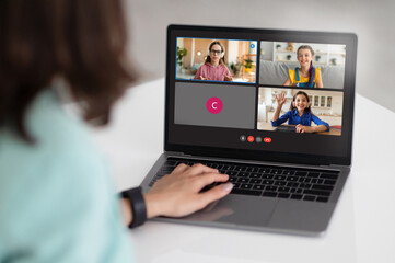 Poster - Teacher with computer having video conference chat with class