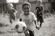 © Straxer - Small child with friends before or after a game of soccer.