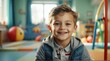 © Arceli - Portrait of a happy kid boy playing on a kindergarten room from Generative AI