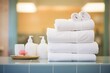white towels stacked neatly beside a steam room