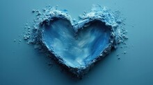  A Blue Heart Shaped Object With A Lot Of Blue Stuff In The Middle Of The Heart, On A Blue Surface, With Small White Bubbles On The Bottom Of The Left Side Of The Heart.