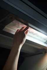 Poster - A person reaching out of a window, offering a helping hand. Can be used to depict support, assistance, or connection