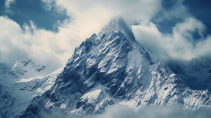 Poster - A majestic mountain covered in a blanket of snow, surrounded by ethereal clouds. Perfect for nature and landscape enthusiasts.