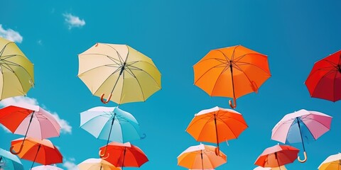 Poster - Colorful umbrellas floating in the air. Ideal for adding a playful touch to any design project