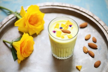 Wall Mural - lassi surrounded by mango and almonds