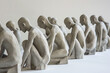 Series of sculptures portraying figures in diverse poses of waiting - with each piece artistically symbolizing various aspects of expectation - time - and the introspective nature of waiting.