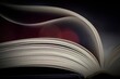 © GTood Photo - A close-up of book pages with red and dark background