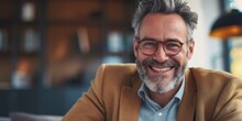 Smiling Man With Beard And Glasses