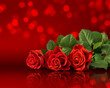 Valentine's Day card with roses bouquet on a red background with glowing bokeh.