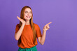 © deagreez - Photo of young redhair girl happy emotions direct finger banner touch cheek when introduce brand logo isolated on violet color background