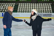 young couple at ice rink