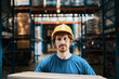 © Davor - Portrait of a young caucasian male warehouse worker holding a cardboard box in a warehouse