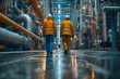 © Ala - Engineers in helmets walk around the plant