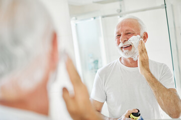 man bathroom shaving senior beard care morning hygiene razor beauty shave skin face hair old mirror skincare elderly routine mature cream grooming foam