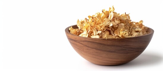 Wall Mural - Isolated white background with dried linden blossom in wooden bowl.