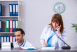 © Elnur - Two doctors working at the reception in the hospital