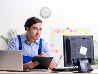Poster - Male it specialist working in the office