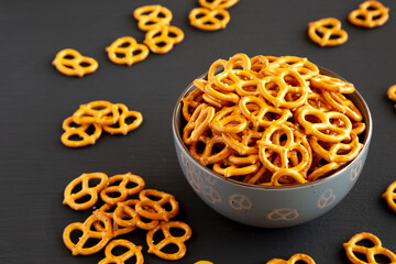 Wall Mural - Mini Pretzels with Salt in a Bowl, side view.
