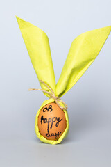 Poster - egg wrapped in bunny shaped napkin