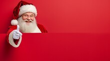 The Old Grandfather In Santa Claus Costume With His White Beard And Smiling Face On A Red Background For Advert Replacement