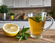 Tea made with mint and lemon prepared on the kitchen counter