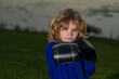 Kid boy practicing martial arts outdoor. Sport martial arts kids. Little boy wearing kimono doing karate in park. Child with boxing gloves training martial arts. Little fighter. Martial arts for kids.