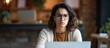 © The 2R Artificiality - Skeptical and nervous middle-aged Hispanic woman working in small business e-commerce, frowning upset due to a problem and negative outlook.