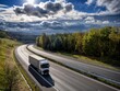 White truck driving on the highway winding through forested landscape in autumn colors at sunset with dark clouds