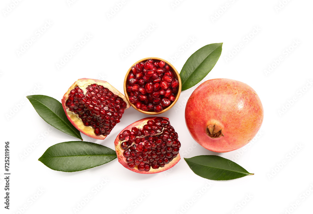 Fresh pomegranates and bowl with seeds on white background