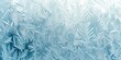 Frosty window pattern, with intricate ice crystals and a soft bluish hue, creating a cold, wintry feel