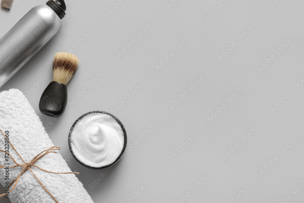 Set of shaving accessories on grey background