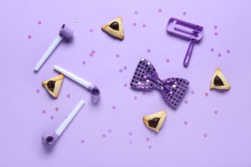 Wall Mural - Hamantaschen cookies with party whistles, bow tie and decor for Purim holiday on lilac background