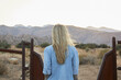 © Diana Koenigsberg - blond woman from behind walking in Joshua tree national forest