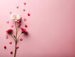 delicate flowers and small hearts on a pink background