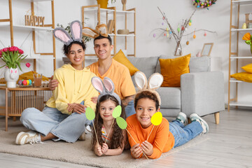 Poster - Little children with paper eggs and their parents at home on Easter Day