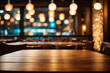 image of wooden table in front of abstract blurred background of restaurant lights