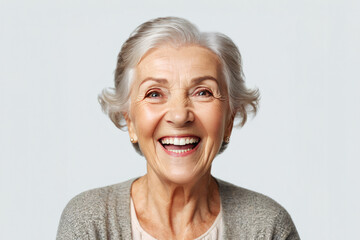 Portrait of senior female smiling woman looking at camera laughing