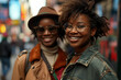 © Sergio - Happy stylish African American girlfriends together on a city street, lifestyle. Portrait of smiling beautiful young woman with friend looking at camera