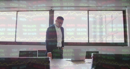 Poster - Image of interface showing financial data and statistics with businessman working in office